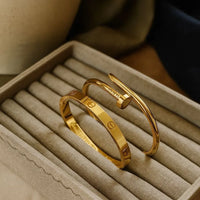 Screw Motif Oval Bangle Bracelet
