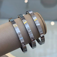Screw Motif Oval Bangle Bracelet